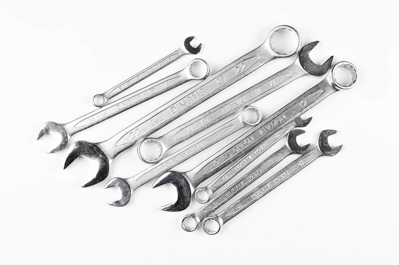 Different sizes of wrenches on white background