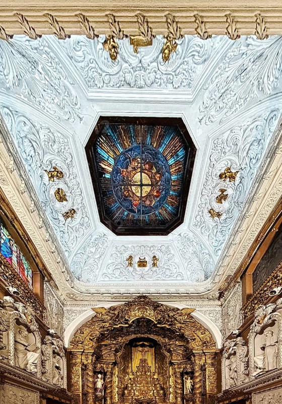 Igreja Paroquial de Santo Ildefonso, interior with altar and view of the ceiling of the Catholic church built in the 18th century, Porto, Portugal