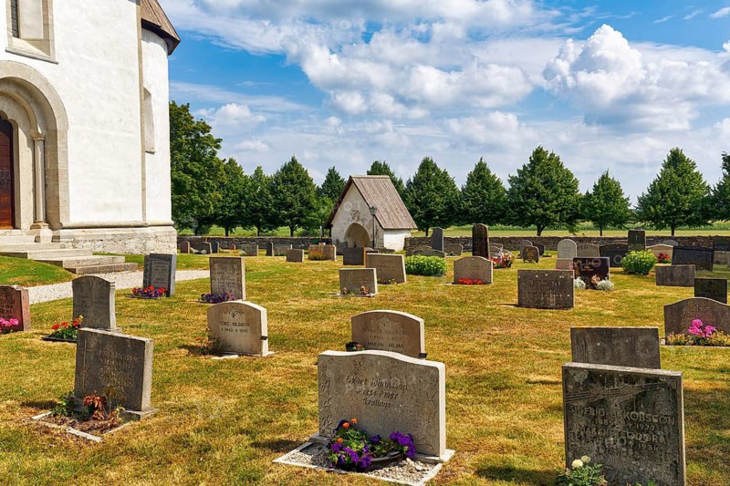 Cemetery of the medieval church of Gothem, tombstones, Gothem kyrka, east coast, island of Gotland, Sweden