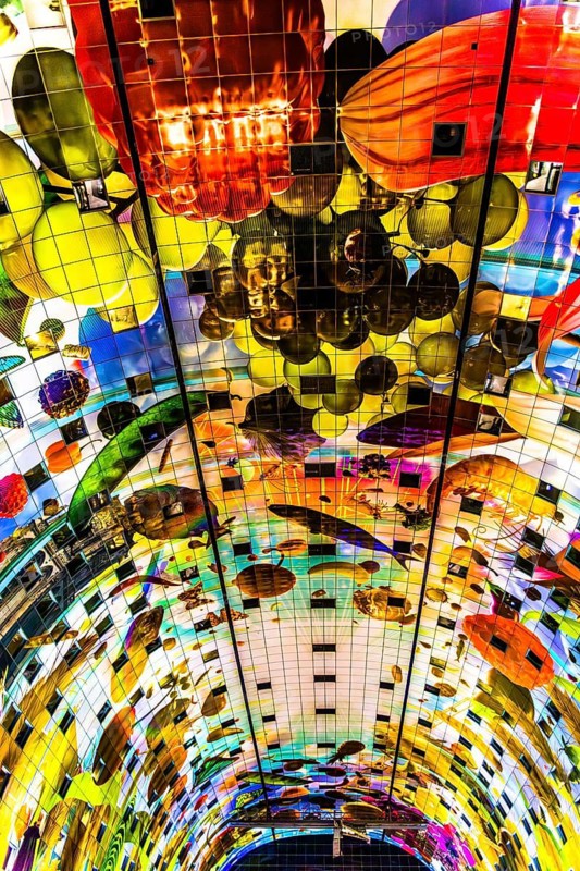 Markthal from 2014, offers over 100 food stalls and delicatessens with spectacular ceiling fresco cornucopia, Horn of Plenty by Arno Coenen and Iris Roskam, Rotterdam, the Netherlands