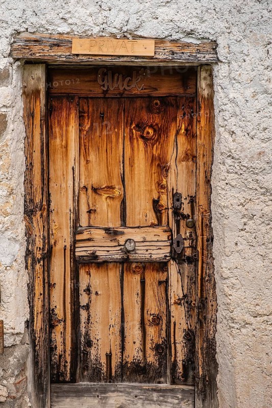 A rustic wooden door from a hut on the Glatsch Alm, Dolomites, Puez-Geisler nature park Park, Geisler Group, St. Magdalena, Villnöß, Funes, Villnößtal, South Tyrol, Italy