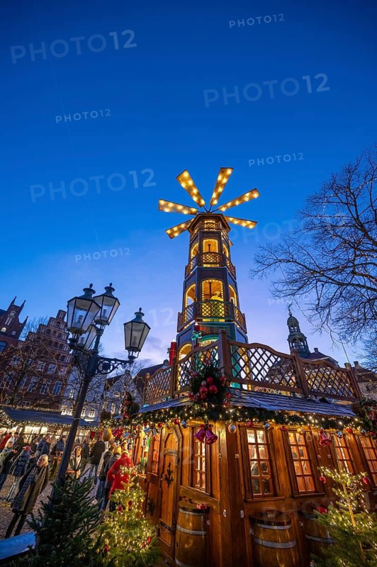 Large Christmas pyramid at the Christmas market on the market square, Lüneburg, Lower Saxony, Germany