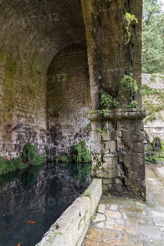Old covered water basin at the Porta Docciola city gate, Volterra, Province of Pisa, Tuscany, Italy