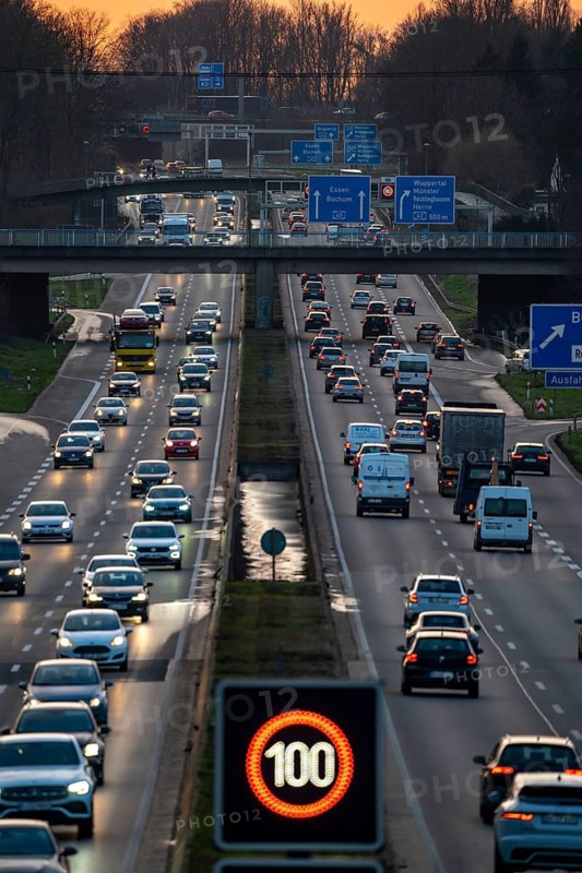 Motorway A40, Ruhrschnellweg, near Bochum, dense evening traffic, in front of the motorway junction Bochum, A43, view in west direction, North Rhine-Westphalia, Germany