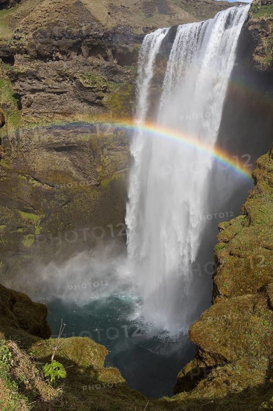 Skógafoss is a waterfall situated on the Skógá River in the south of Iceland. Height 60 m, width 25 m. Rainbow over the waterfall