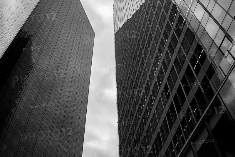 Black and white abstract view of high rise glass fronted office buildings in a Paris commercial and financial district, France