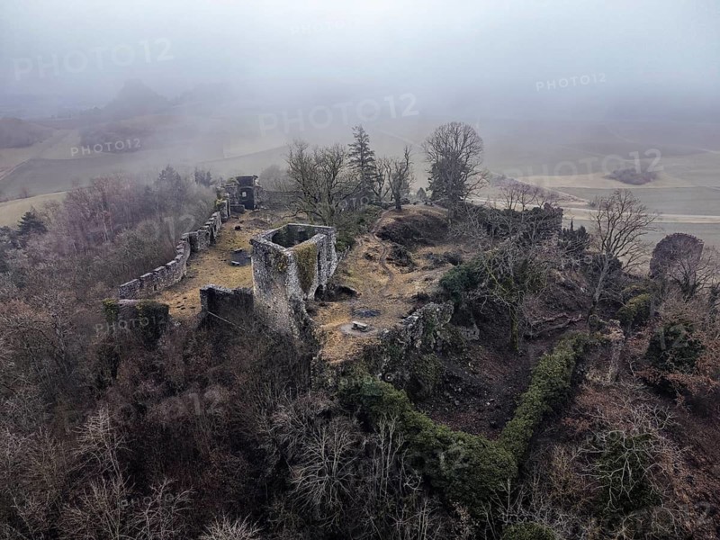 Aerial view of the ruins of Mägdeberg Castle in Hegau on a foggy winter day, Mühlhausen-Ehingen, district of Konstanz, Baden-Württemberg, Germany