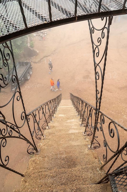 Rye, Colorado, A steep stairway leading to Bishop Castle on a foggy morning. The Castle is an elaborate stone and metal structure and roadside attraction. It is being built by Jim Bishop in the mountains of San Isabel National Forest