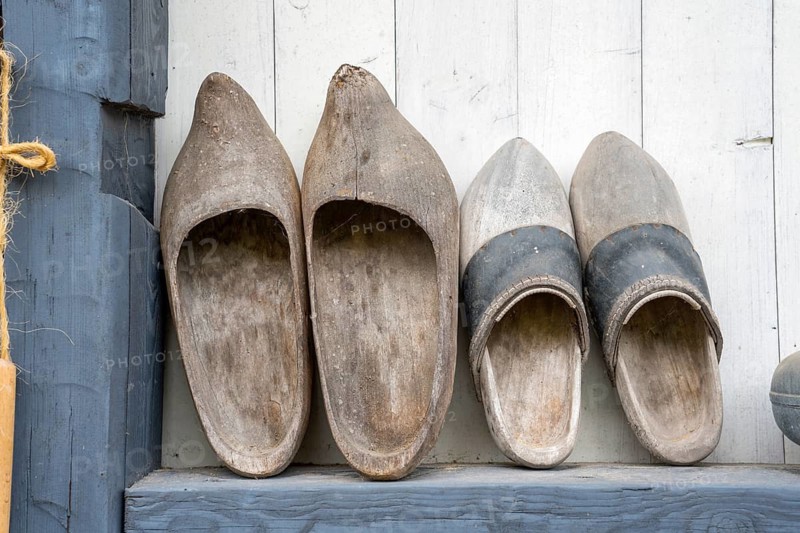 Decoration with old wooden clogs, klompen from the Netherlands, Wesertal, Weser Uplands, Weserbergland, Hesse, Germany