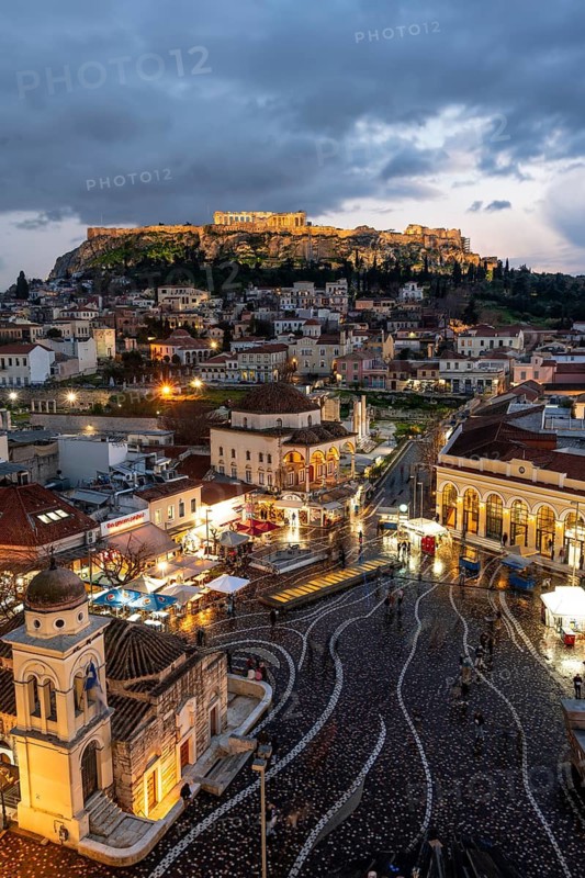 View over the old town of Athens, with Panagia Pantanassa Church, Tzisdarakis Mosque and Acropolis, illuminated Monastiraki Square, Athens, Attica, Greece