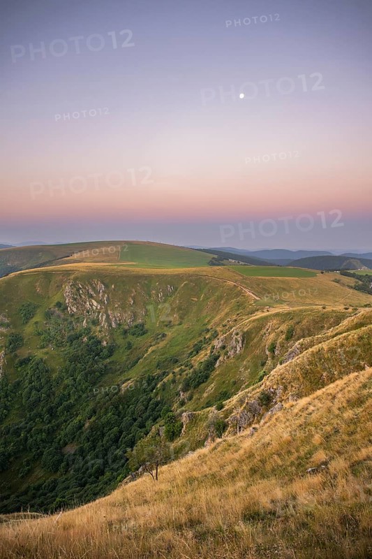 Sunrise mith the moon at Mount Hohneck in the Vosges Mountains, France