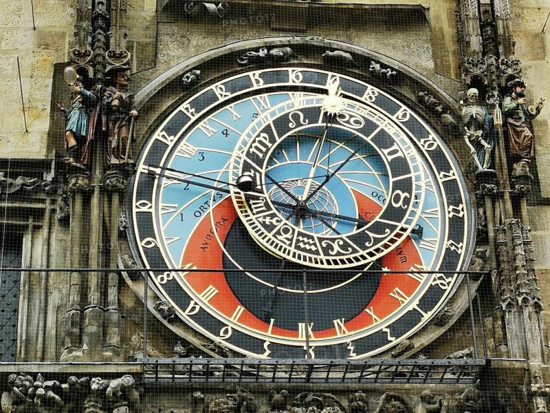 Historic astronomical clock at Prague City Hall with complex mechanics and colorful details in Gothic style, Prague