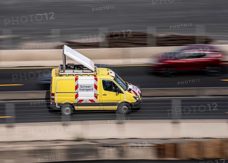 Support vehicle for heavy transport, drives behind the transport to warn road users, which is usually oversized or long and often travels slowly, Duisburg, North Rhine-Westphalia, Germany