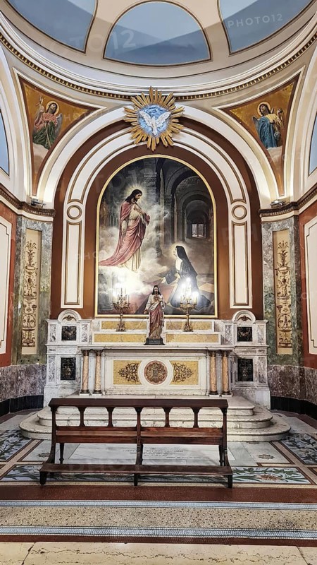 Magnificent church interior of the Catedral Metropoltana de Buenos Aires with artfully designed altar and religious paintings, Buenos Aires, Argengtinia, South America