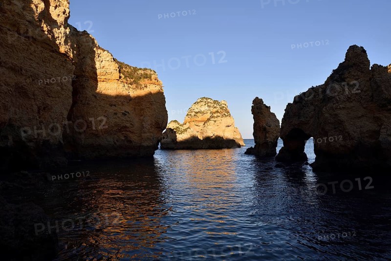 Rocky coast in evening light, Ponta da Piedade, Lagos, Algarve, Portugal