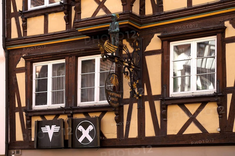 Wimpfener Bank nose sign, Volksbank, Raiffeisenbank, logo, half-timbered house, old town, Bad Wimpfen, Kraichgau, Baden-Württemberg, Germany