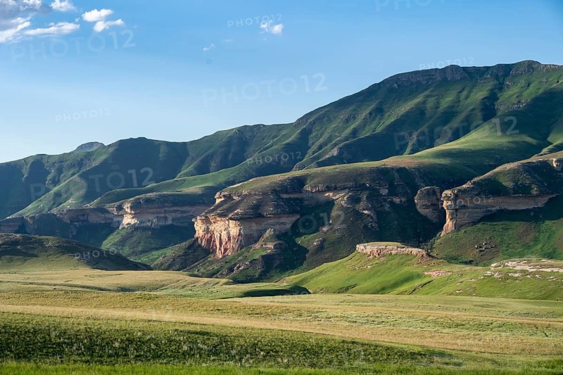 Grassland with sandstone rocks and cliffs, landscape in Golden Gate Highlands National Park, Free State, South AfricaGrass land with sandstone cliffs and cliffs, South Africa