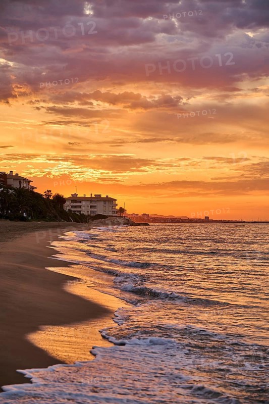 Sunrise with morning colors on a sandy beach near Tarragona, Catalonia, Spain
