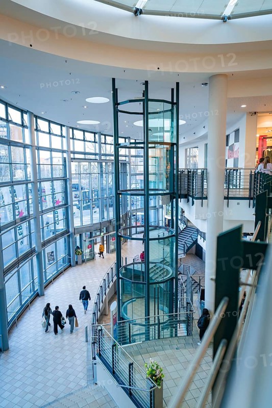 Modern glass lift in a bright shopping centre with open architecture, Sterncenter Sindelfingen, Böblingen district, Germany