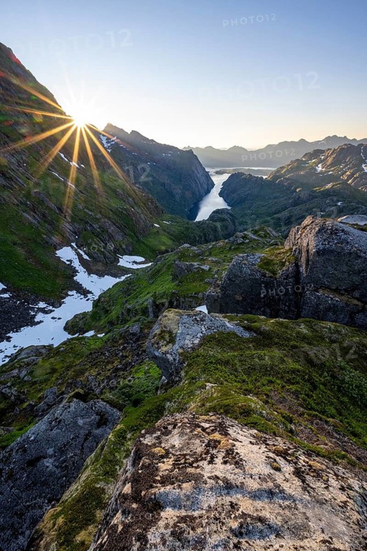 Picturesque mountain landscape at sunrise with sun star, fjord Trollfjord and Raftsund, hike to Trollfjord Hytta, Lofoten, Nordland, Norway