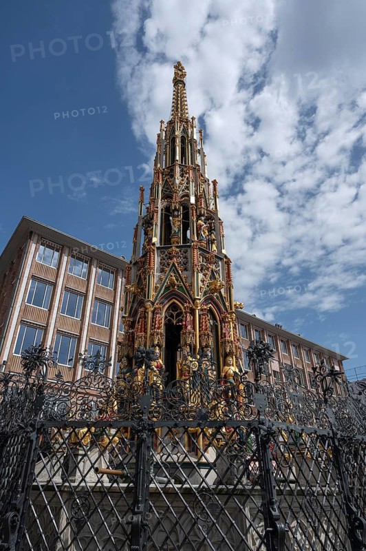 The 19 metre high Schöne Brunnen fountain on the Hauptmarkt is a copy made of shell limestone in 1903, the surviving remains of the original stone fountain can be found in the Germanisches National Museum, Hauptmarkt, Nuremberg, Middle Franconia, Bavaria, Germany