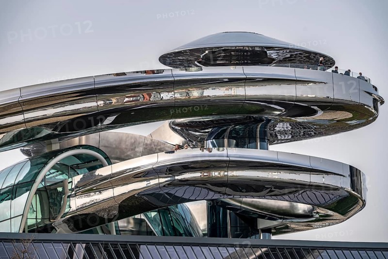 The Fenix Museum of Contemporary Art about migration, in a former warehouse on the Nieuwe Maas, walk-in spiral staircase made of polished stainless steel, in the shape of a double helix, called tornado, 550 meters long from ground floor to a viewing platform on the roof, with a view of the Rotterdam skyline, architect Ma Yansong, the Netherlands
