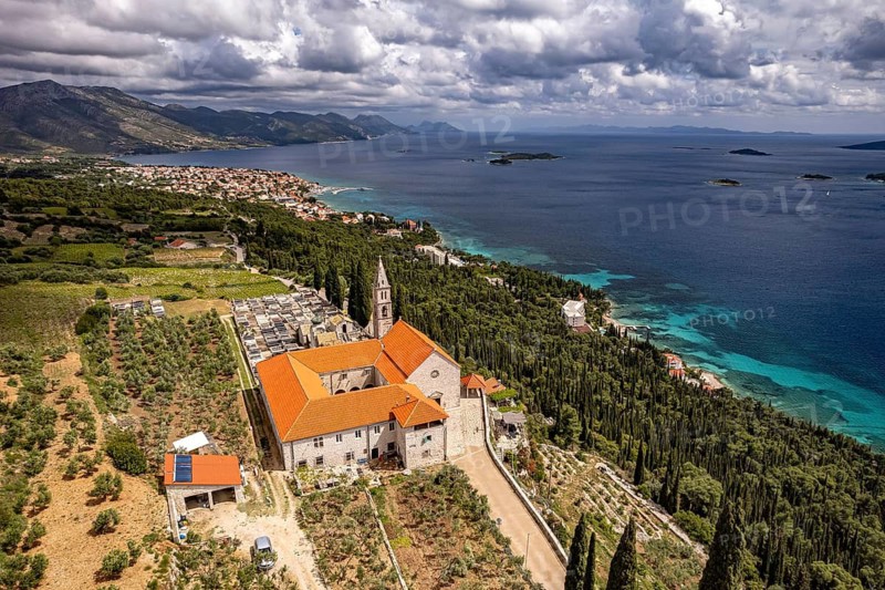 Franciscan monastery and church Madonna of the Angels and the coast seen from above, Orebic, Peljesac peninsula, Croatia