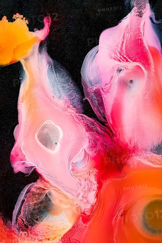 Dynamic abstract artwork featuring vivid swirls of pink, orange, and yellow. The liquids textures and contrasting colors create a sense of movement and energy in the galaxy