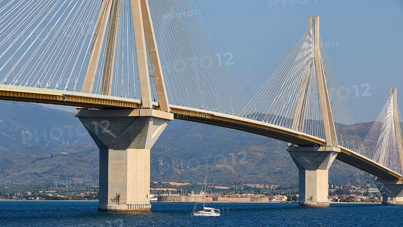 Close-up of a bridge with steel cables and a boat on the water, Rio-Antirrio cable car bridge, Patras, Peloponnese, Greece