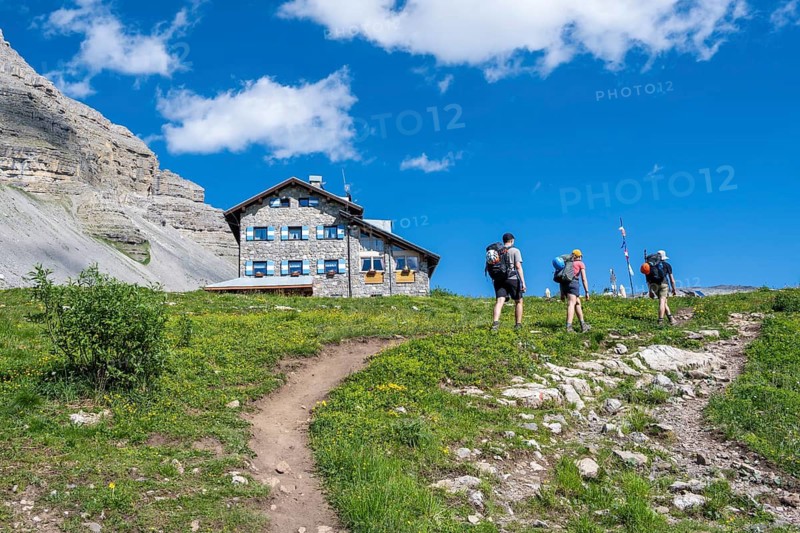 Hikers in front of Rifugio Graffer, Brenta, Brenta-Adamello Natural Park, Trentino, Italy