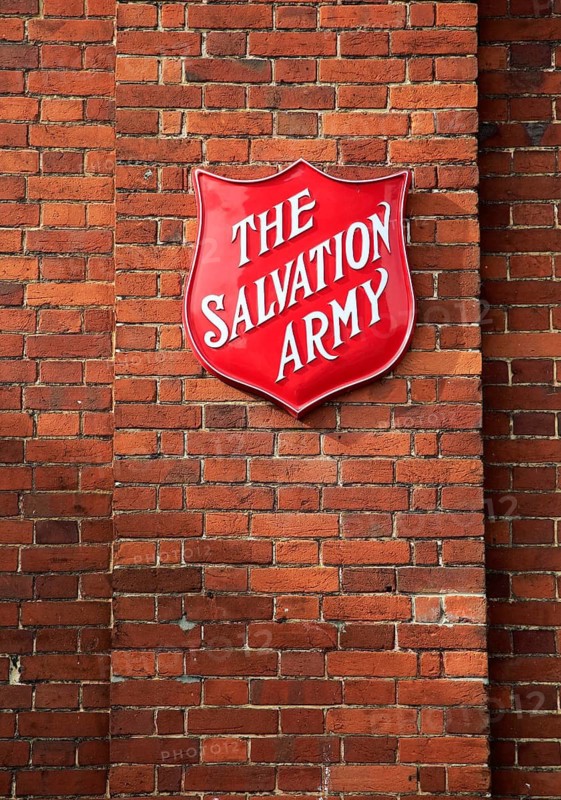 Salvation Army sign on brick wall, Andover, Hampshire, England, United Kingdom