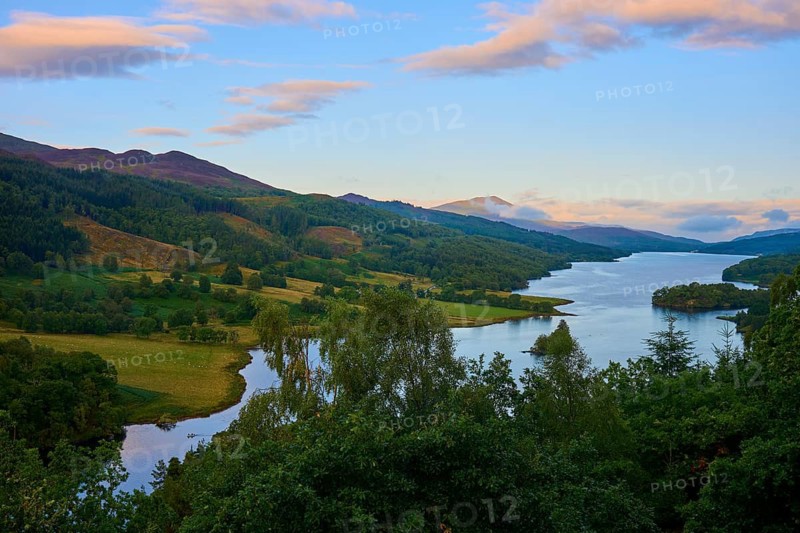 Picturesque lake at sunset surrounded by hills and forest, with colorful sky, Queens View, Fincastle, Pitlochry, Scotland, United Kingdom, Great Britain