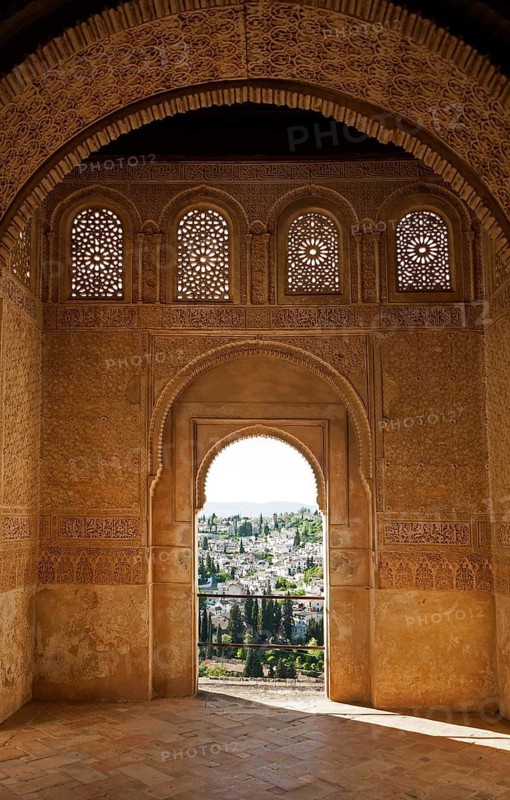 Stone arches in Islamic key shape in the Generalife palace, Alhambra, Granada, Spain