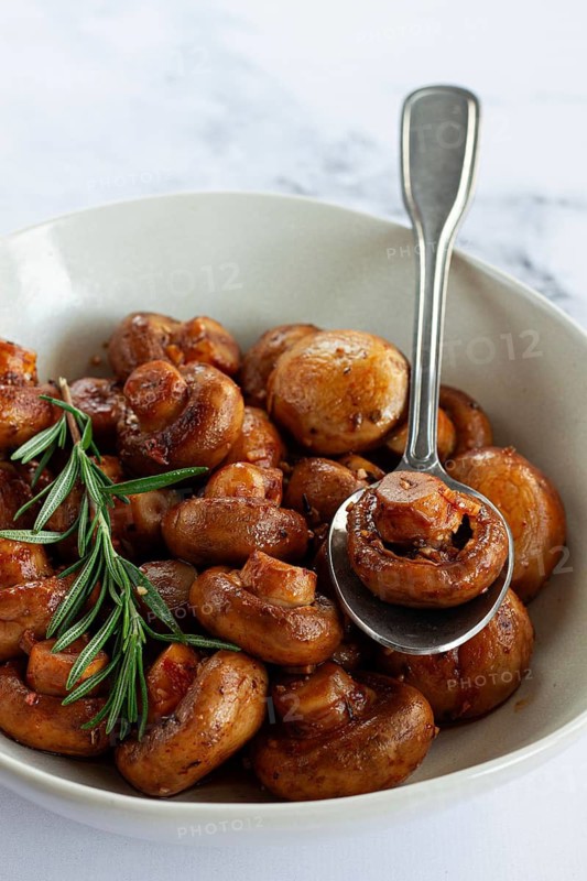Fried mushrooms, with spices, in soy sauce, vegetarian food, homemade, no people