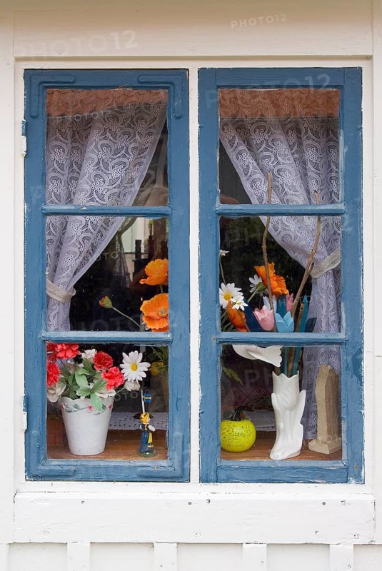 Decorated wooden window, decoration, history, historical, village, old-fashioned, culture, rural in a village in Sweden