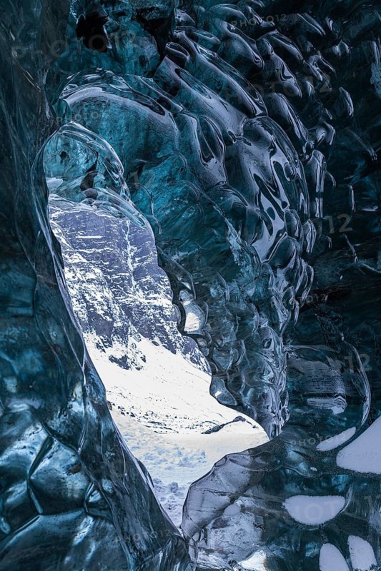 Ice cave open to the top with snow-covered ice combs, Pröng ice cave, Sudurland, Iceland
