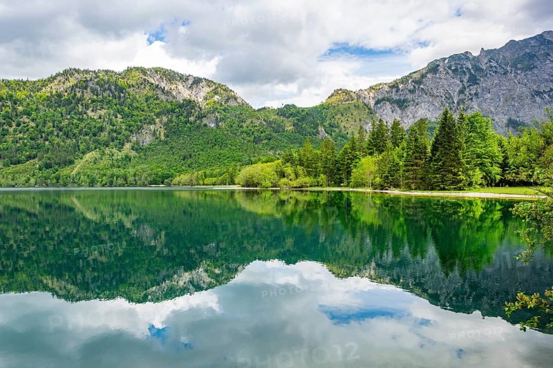 Landscape of Lake Offensee after rain when the sun comes through the clouds in spring, Salzkammergut, Austria