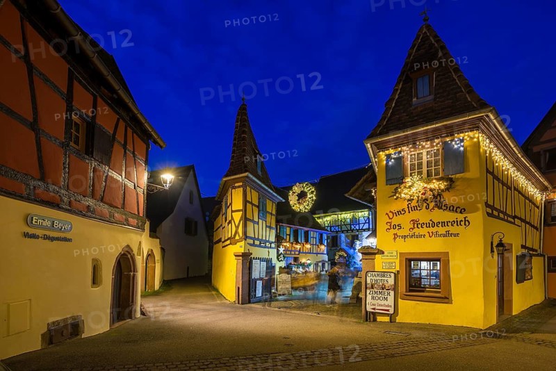 Houses illuminated and decorated for Christmas, Christmas market, blue hour, Eguisheim, Haut-Rhin department, Grand Est region, Alsace, France