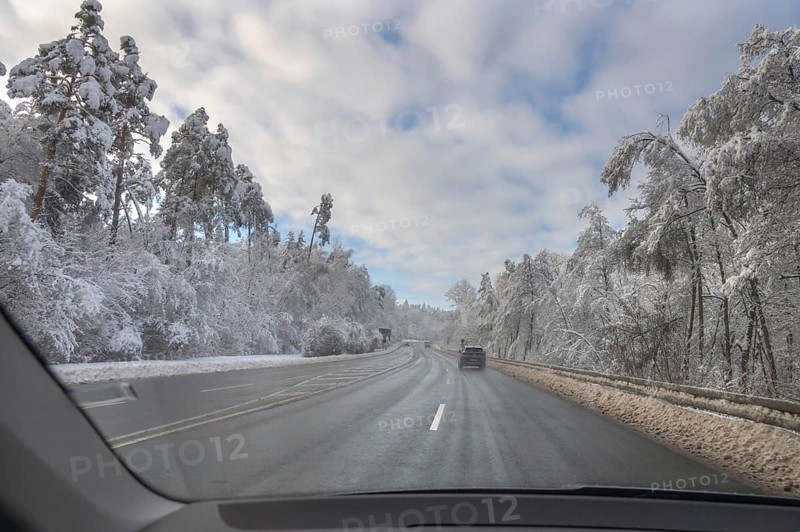 View from car, snowy landscape with cleared federal road, Heroldsberg, Middle Franconia, Bavaria, Germany