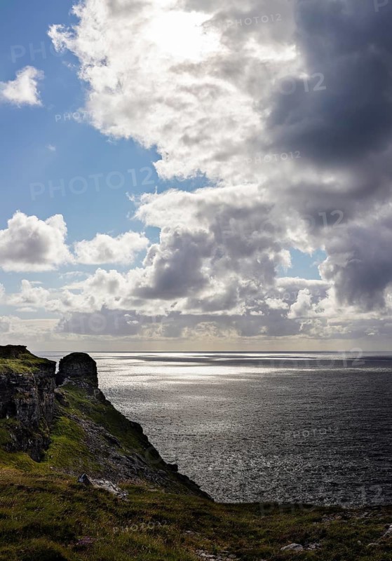 Cliff landscape with cloudy sky over the sea, Cliffs of Moher