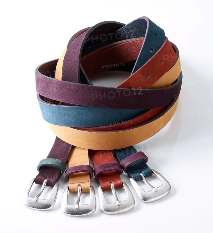 Leather belt in front of a white background, studio shot