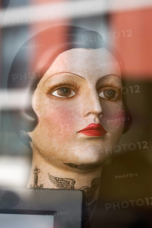 Woman's head from the 1920s in a show theatre of a tattoo studio, Erlangen, Middle Franconia, Bavaria, Germany