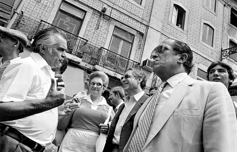 Men and woman talking on a street in Lisbon, Lisbon, Portugal