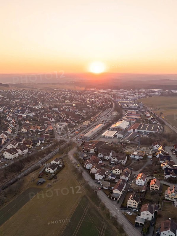 Peaceful aerial view of a small town at sunset with houses and fields, Althengstett, district of Calw, Germany