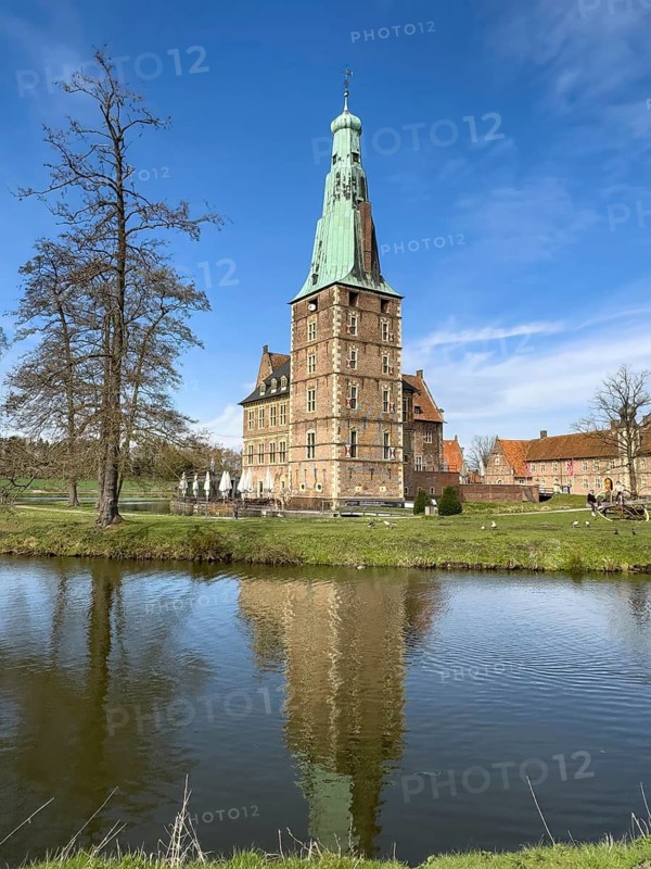 View over moat to historic moated castle from Renaissance Raesfeld Castle in spring, Freiheit Raesfeld, Münsterland, North Rhine-Westphalia, Germany