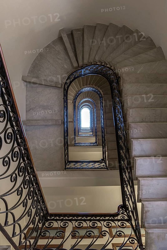 Staircase around 1900 with a wrought-iron banister, in a residential building, Genoa, Italy