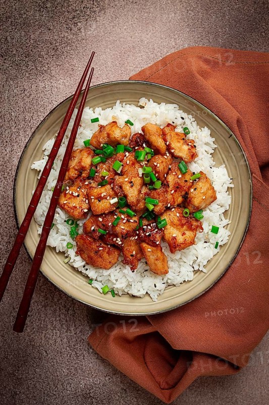 Fried chicken teriyaki with rice, green onion and sesame, homemade, no people