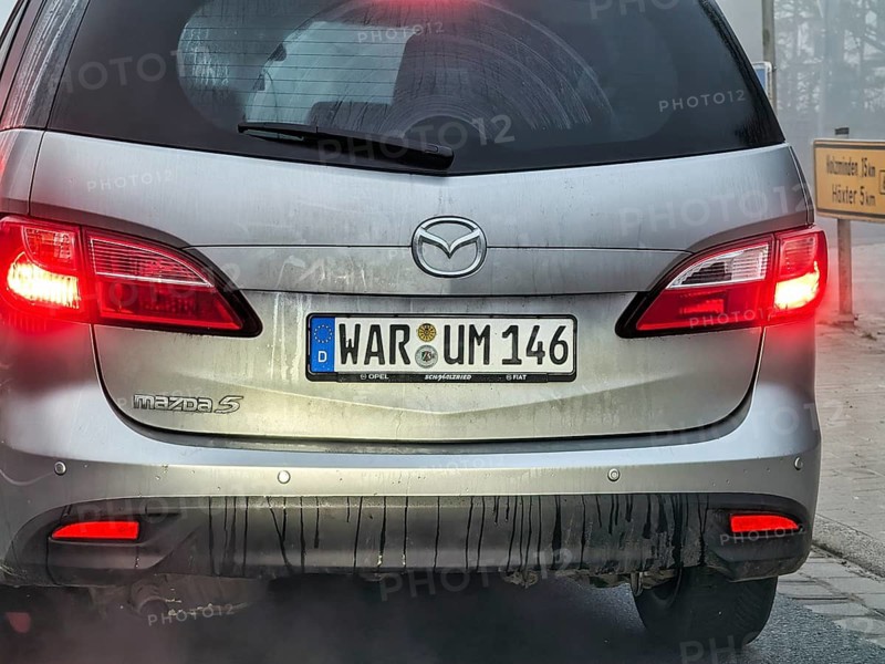 Car with license plate, original license plate, word why, symbolic image, question about reason, cause, purpose, old license plate of the former district of Warburg, license plate liberalization, Höxter district, Germany
