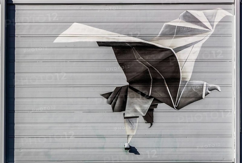 Street art Flight of a Man, outer wall of the former Keilewerf 1, M4H area, Merwe-Vierhavens, artists Tymon de Laat and Nuno Viegas, Rotterdam, Netherlands