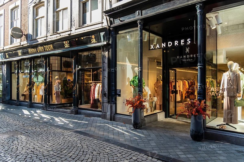 Alley with cafes and shops in the old town of Maastricht, the Netherlands